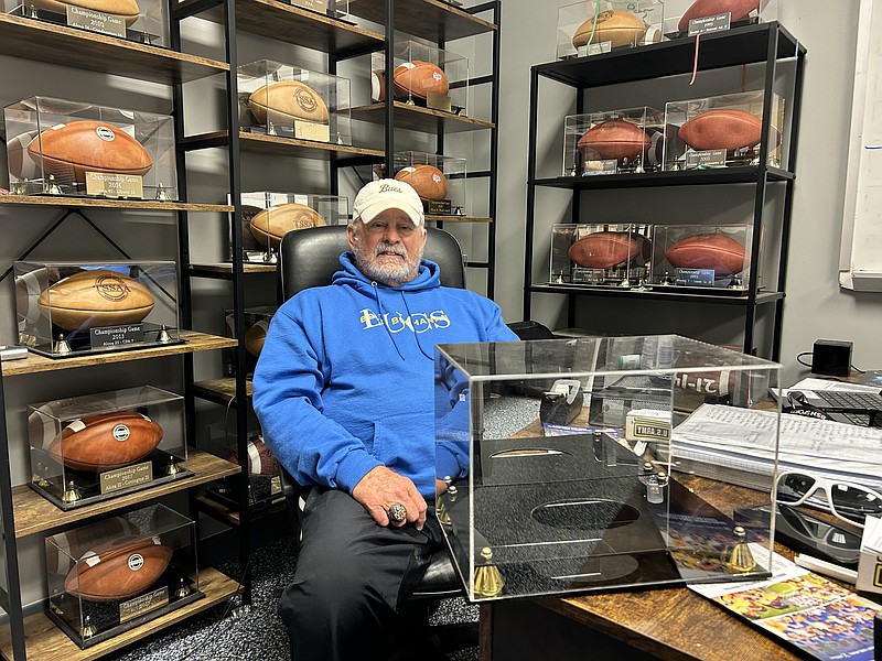 Staff photo by Stephen Hargis / Boyd Buchanan football coach Gary Rankin, shown in his office at the Chattanooga private school, is surrounded by game balls from his 23 state final appearances, with 17 of those victories. The empty case is for his first BlueCross Bowl with the Buccaneers, set for Thursday at Finley Stadium.