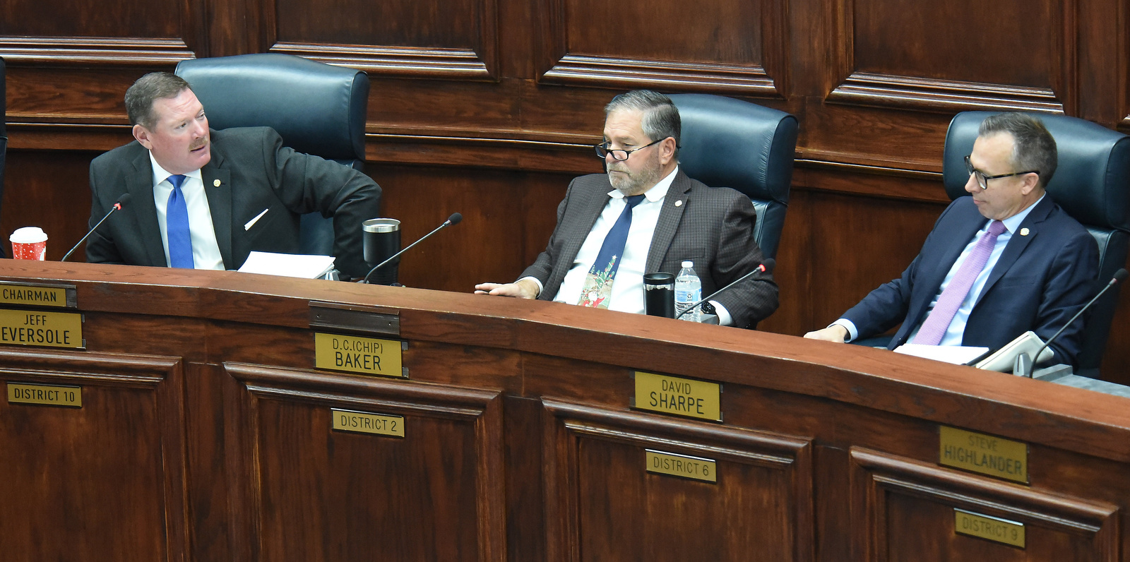 Staff photo by Matt Hamilton / Chair Jeff Eversole, left, talks to David Sharpe, right, during a County Commission meeting at the Hamilton County Courthouse on Wednesday.