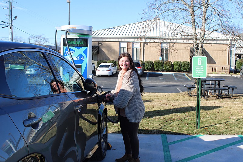 Scottsboro Electric Power Board / Skylar Putman, Scottsboro Electric Power Board customer service representative, plugs in the inaugural charge of the new DC Fast Chargers.