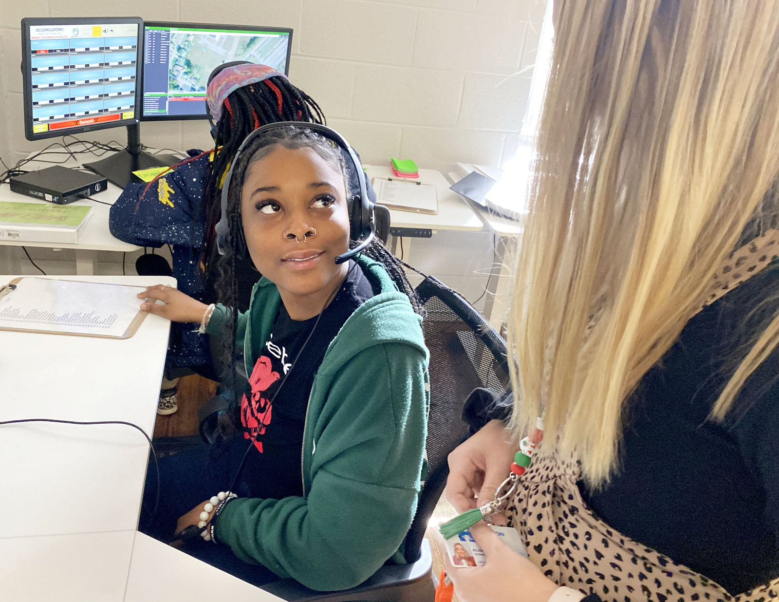 Staff Photo by Robin Rudd / Jamariya Waddle confers with criminal justice teacher, Alisha Chavez, on Thursday. Brainerd High has launched a new 911 dispatch pathway this fall as part of the Future Ready Institute of Law, First Responders and Forensic Science.