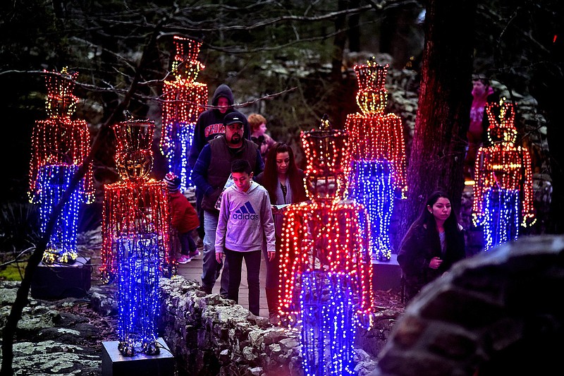 Staff file photo by Robin Rudd / Colorful toy soldiers guard the paths as visitors walk past at Rock City's Enchanted Garden of Lights. The Enchanted Garden of Lights will run nightly through Jan. 6.