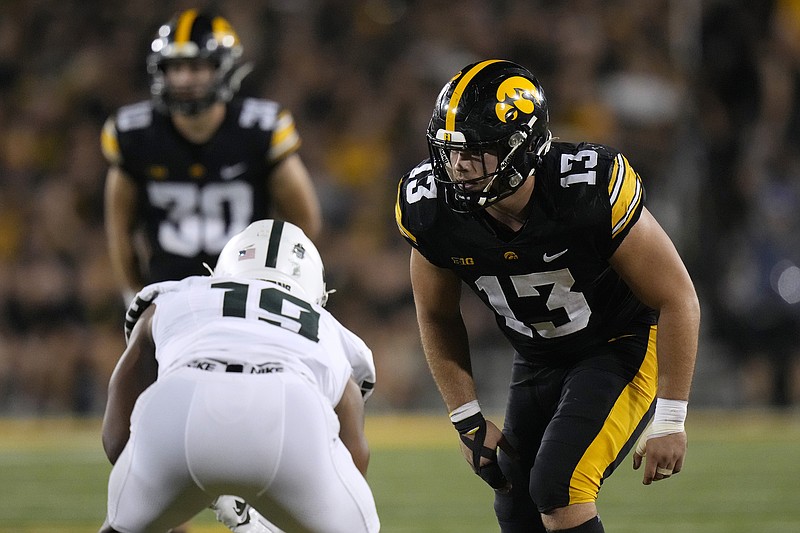 AP photo by Charlie Neibergall / Iowa defensive end Joe Evans (13) gets set for a play during a home game against Michigan State on Sept. 30.