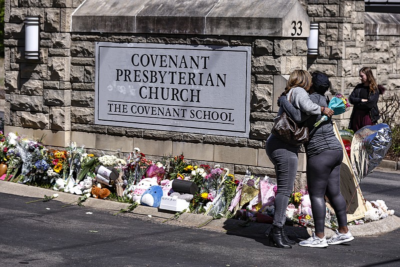 FILE - Two women hug near a memorial at the entrance to The Covenant School on March 29 in Nashville. (AP Photo/Wade Payne, File)