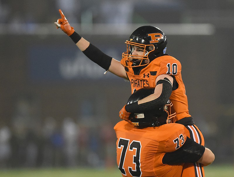 Staff photo by Matt Hamilton / South Pittsburg's Logan Sisk lifts Cavin Gilley after Gilley intercepted a McKenzie pass during the TSSAA Class 1A BlueCross Bowl state championship game Friday at Finley Stadium.