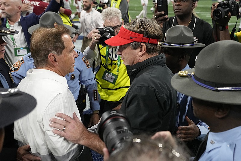 AP photo by John Bazemore / Georgia football coach Kirby Smart, right, and Alabama counterpart Nick Saban meet on the field at Mercedes-Benz Stadium after Saturday's SEC championship game in Atlanta.
