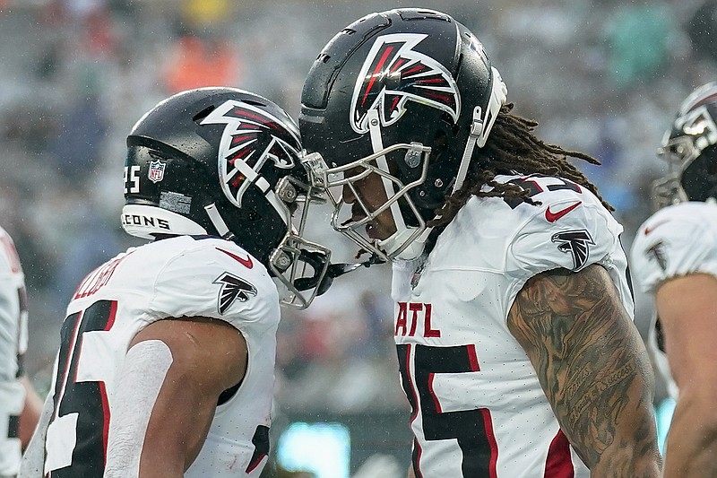 AP photo by Seth Wenig / Atlanta Falcons tight end MyCole Pruitt, right, celebrates with running back Tyler Allgeier after Pruitt's touchdown catch during the second quarter of Sunday's game against the New York Jets in East Rutherford, N.J.