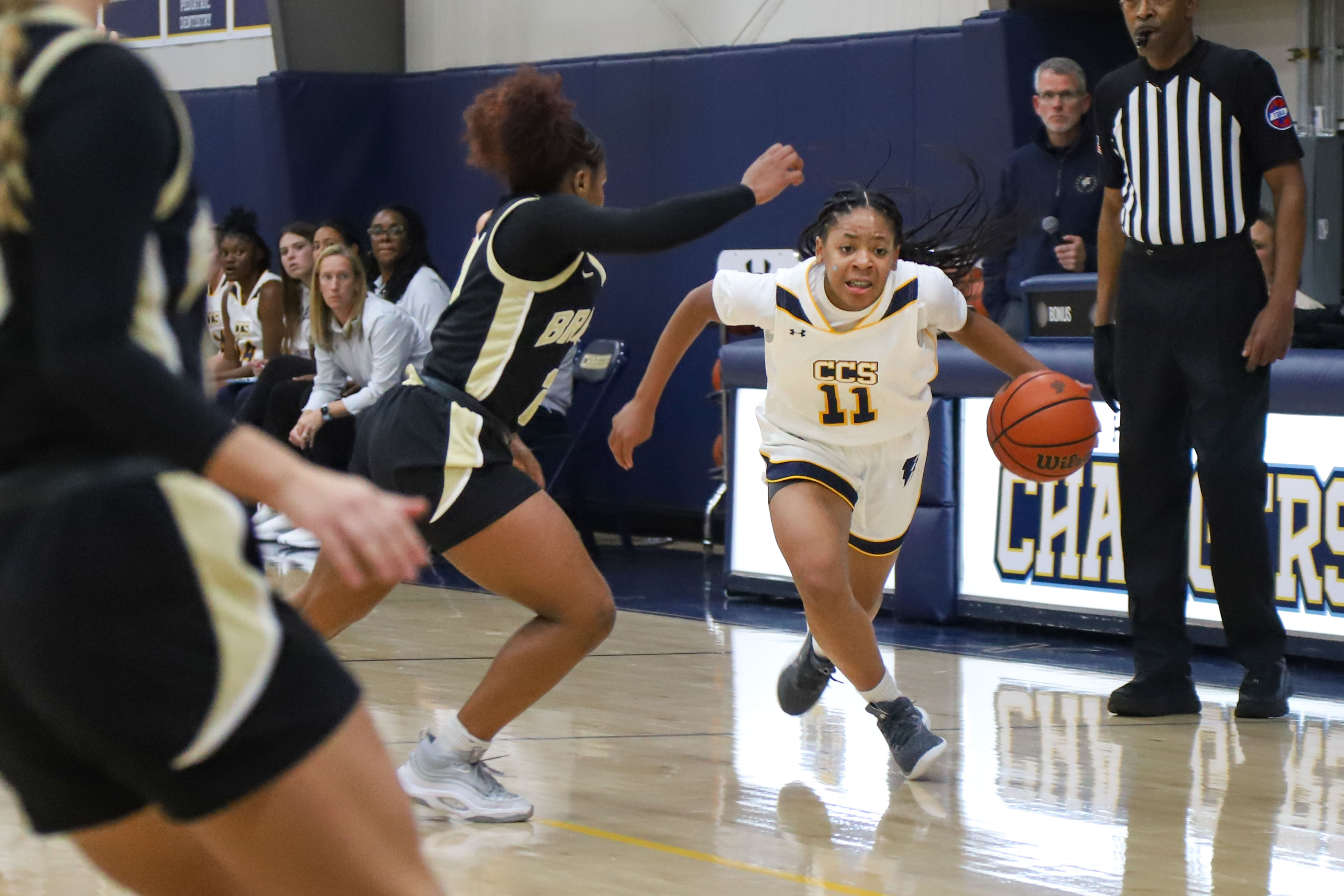 Staff photo by Olivia Ross / CCS's Momo Moore (11) dribbles the ball in, guarded by Bradley's Malia Wilcox (20). Chattanooga Christian took on Bradley Central at home on Tuesday, December 5, 2023.
