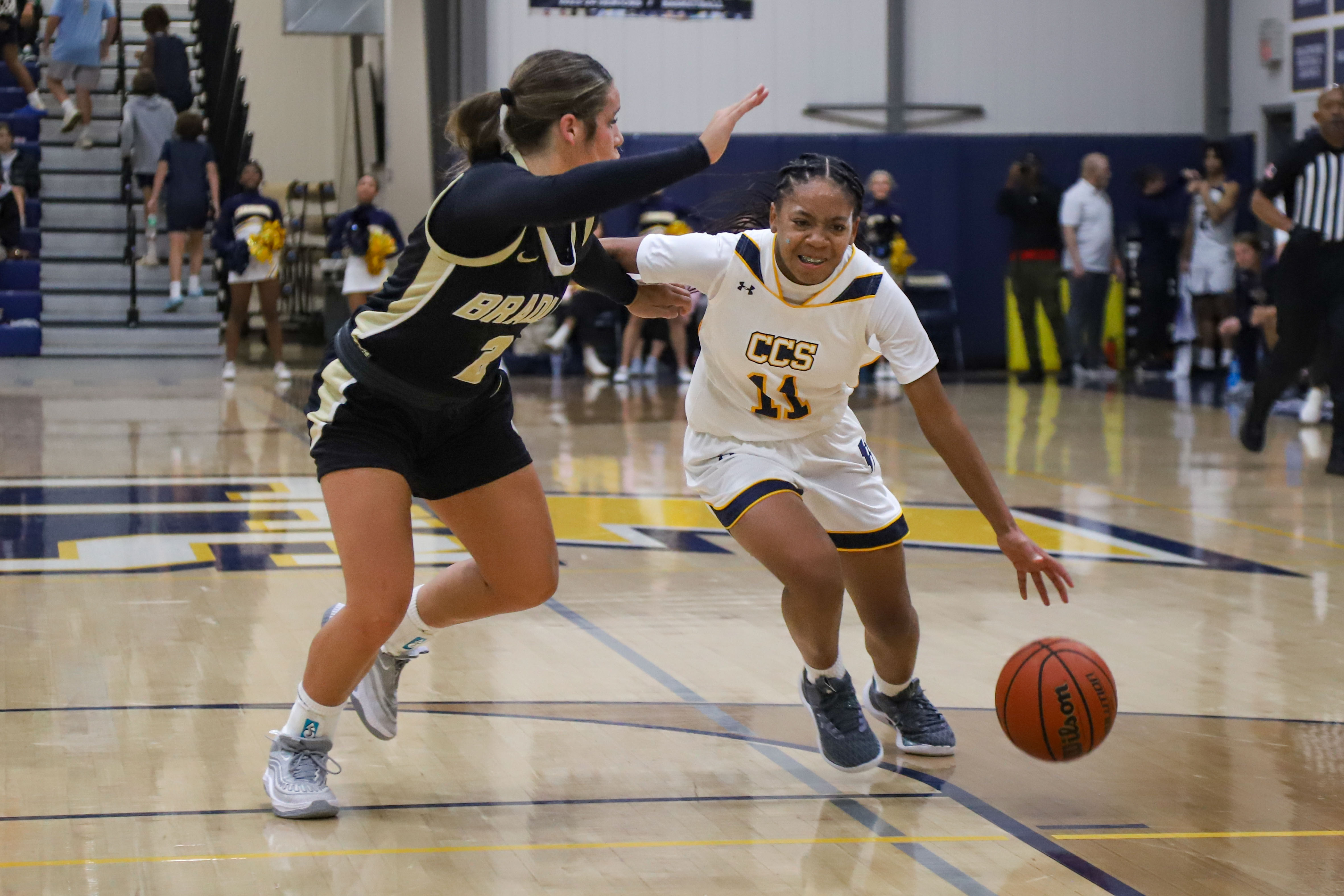 Staff photo by Olivia Ross / CCS's Momo Moore (11) looks to get around Bradley's Avery Brewer (2). Chattanooga Christian took on Bradley Central at home on Tuesday, December 5, 2023.