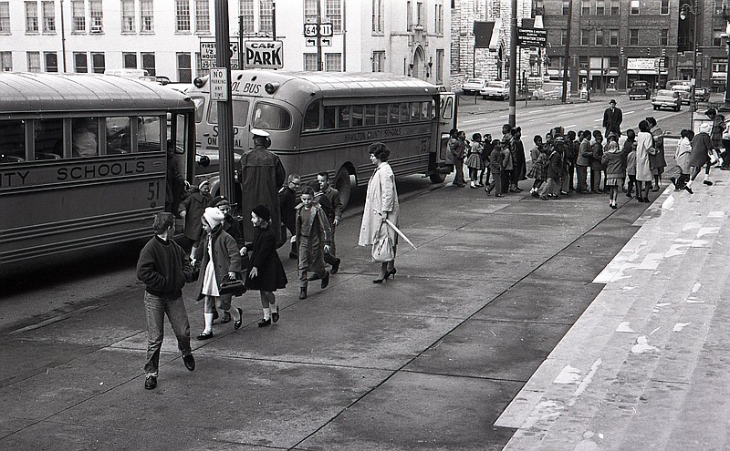 Chattanooga Times Free Press archive photo via ChattanoogaHistory.com / This February 1964 photo of students disembarking from school buses to enter the Memorial Auditorium on McCallie Avenue recalls mid-20th century racial segregation in public schools.