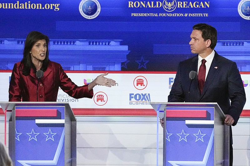 AP Photo/Mark J. Terrill Republican presidential candidate and former U.N. Ambassador Nikki Haley, left, with Florida Gov. Ron DeSantis, speaks during a Republican presidential primary debate hosted by FOX Business Network and Univision, Sept. 27, 2023, at the Ronald Reagan Presidential Library in Simi Valley, Calif. Haley has been rising with donors and voters thanks in part to strong debate performances and the campaign's increased focus on foreign policy. That's come partly at the expense of Florida Gov. Ron DeSantis. But donors and voters seeking an alternative to former President Donald Trump haven't fully coalesced around Haley.