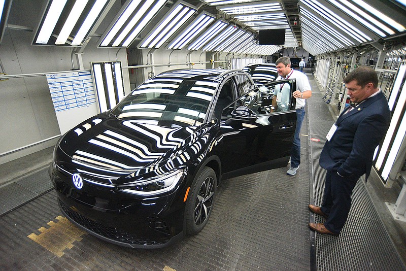 Staff photo by Matt Hamilton / Visitors get a chance to look over new vehicles during the unveiling of the Volkswagen ID.4 electric SUV at the Chattanooga Volkswagen assembly plant in October 2022.