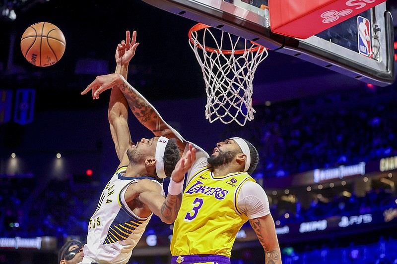 AP photo by Ian Maule / Los Angeles Lakers forward Anthony Davis (3) blocks a shot by Indiana Pacers forward Bruce Brown during the first half of Saturday night's showdown in Las Vegas for the NBA Cup.