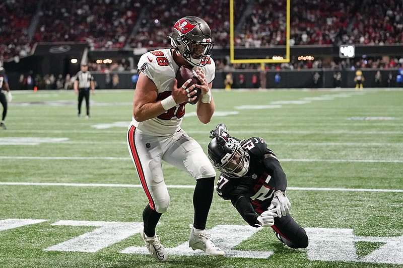 AP photo by Brynn Anderson / Tampa Bay Buccaneers tight end Cade Otton (88) catches a touchdown pass as Atlanta Falcons safety Richie Grant defends in the final moments of an NFC South game Sunday in Atlanta.