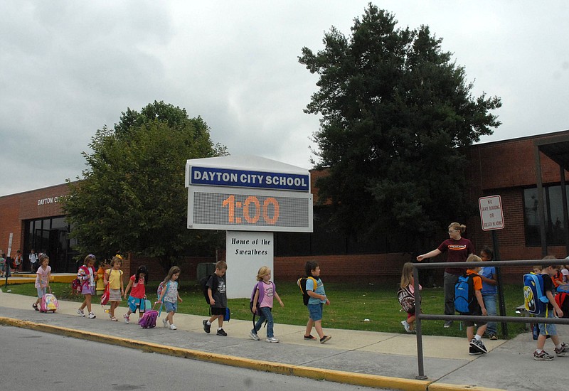Staff Photo / Kindergartner's file out of Dayton City School in September 2009.