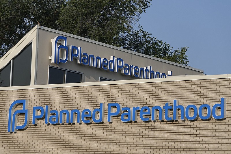 A Planned Parenthood sign is displayed on the outside of a clinic Aug. 1 during a news conference in Indianapolis. (AP Photo/Darron Cummings)