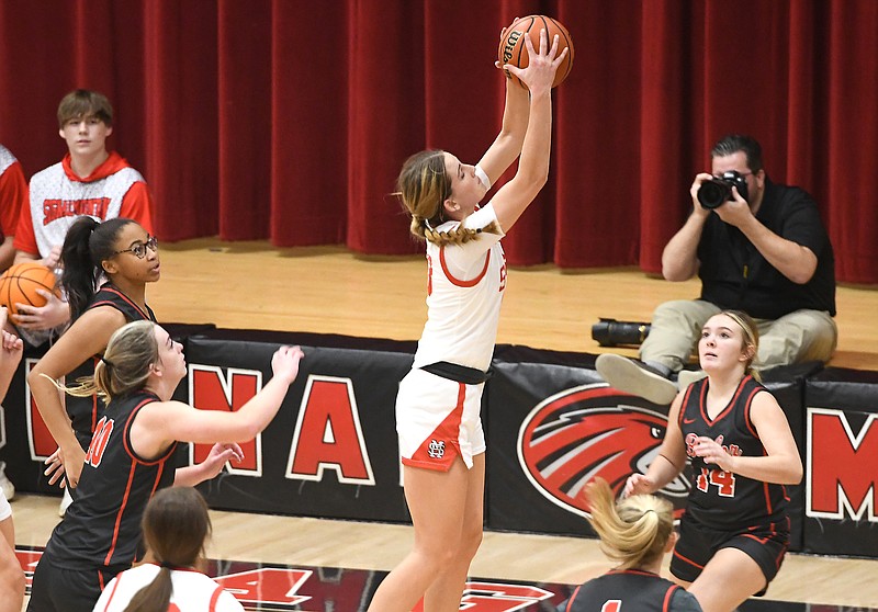 Staff Photo by Robin Rudd / Signal's Carlee Lowry (13) pulls down a rebound.  The Signal Mountain High Eagles hosted the Baylor Raiders in a TSSAA girls basketball game on December 16, 2023.