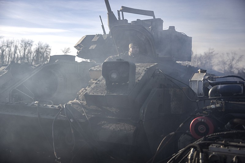 Photo/Finbarr O'Reilly/The New York Times / A Bradley fighting vehicle is repaired at a maintenance yard near the frontline in the Donetsk region of Ukraine on Dec. 26, 2023.