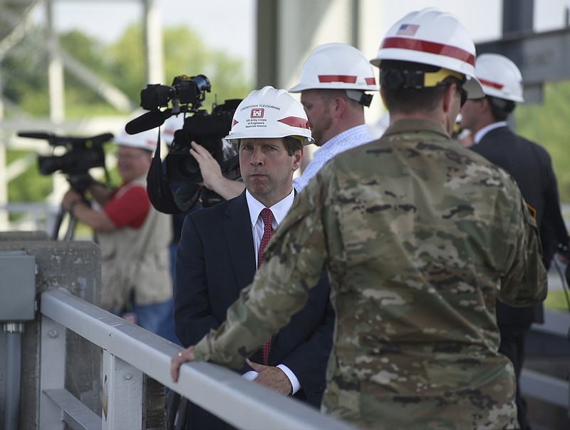 Staff file photo / U. S. Congressman Chuck Fleischmann, center, tours the Chickamauga Lock replacement. He is trying to secure an additional $236.8 million for the project, an earmark that may be affected in upcoming budget wrangling.