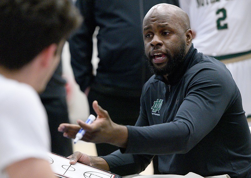Staff photo by Matt Hamilton / Notre Dame boys' basketball coach Jonathan Adams talks to his team during a Times Free Press Best of Preps tournament game against Brainerd on Thursday at Chattanooga State.