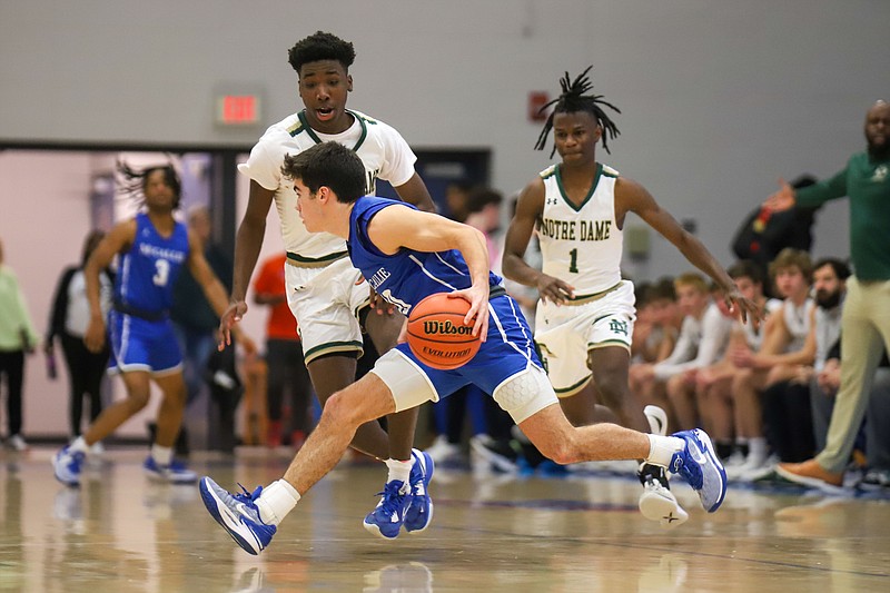 Staff photo by Olivia Ross / McCallie's Parker Robison dribbles upcourt during a Times Free Press Best of Preps tournament semifinal Friday night at Chattanooga State.