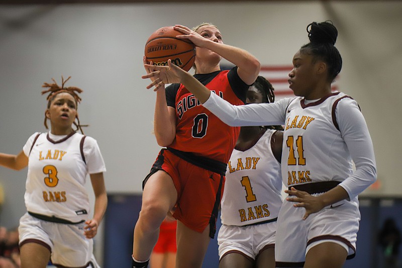 Staff photo by Olivia Ross / Signal Mountain's Abby Walker shoots while guarded by Tyner's Rie'leya Mitchell during a Times Free Press Best of Preps tournament semifinal Friday at Chattanooga State.