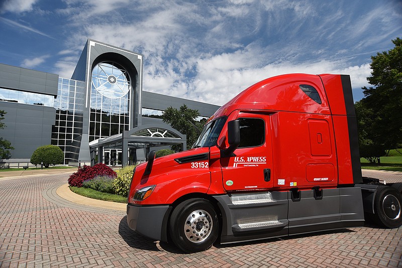 Staff photo by Matt Hamilton / A U.S. Xpress truck is parked in front of the company's headquarters in Ooltewah in 2022. The trucking giant Knight Swift acquired U.S. Xpress in 2023.