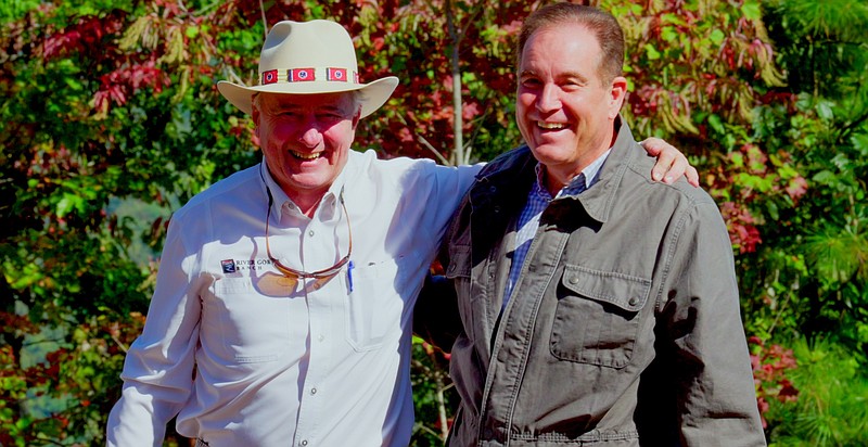 Contributed photo / John "Thunder" Thornton, left, hugs CBS broadcaster Jim Nantz during a visit to River Gorge Ranch atop Aetna Mountain in Marion County.