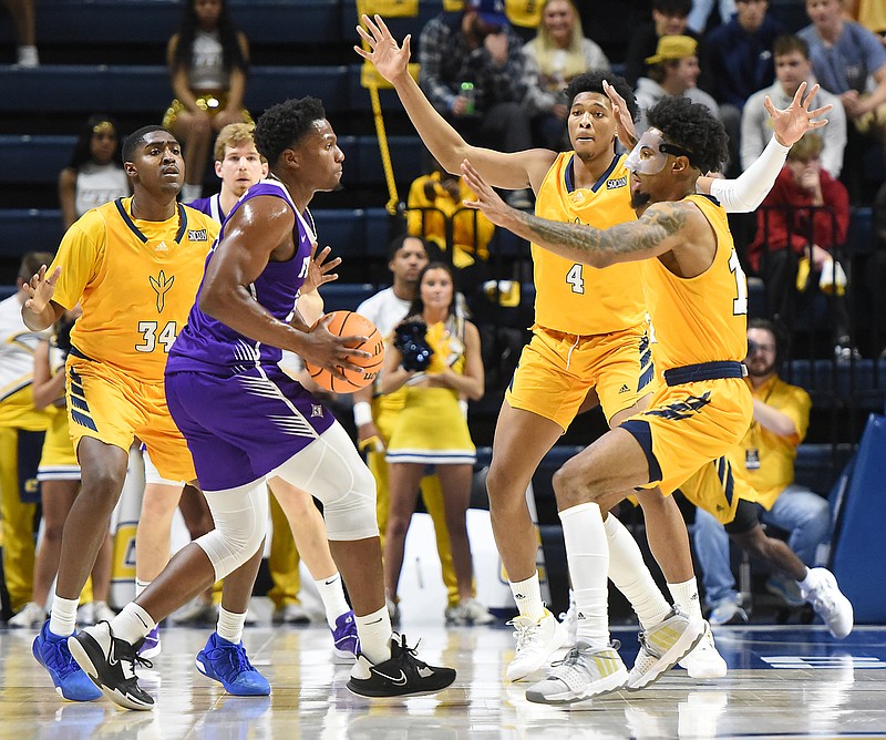 UTC men heat up in home win over reigning SoCon champ Furman ...