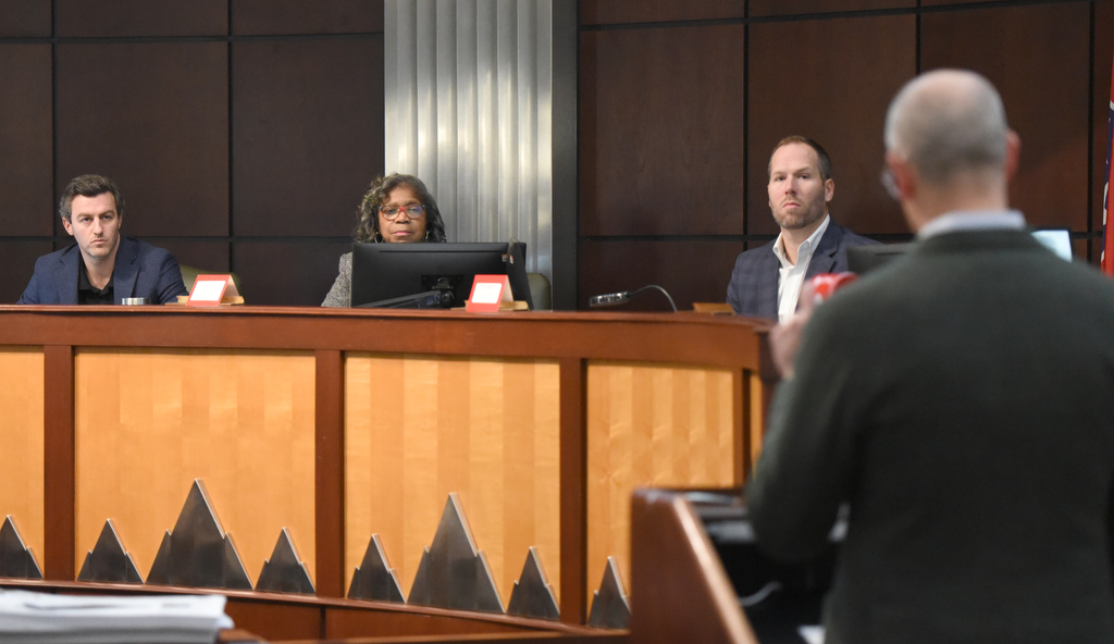 Staff photo by Matt Hamilton/ From left, Matt Patterson, Daisy W. Madison and Brett Smalley listen as Jim Irwin speaks during a meeting by the Chattanooga-Hamilton County Sports Authority at Chattanooga City Hall on Thursday, January 11, 2024.