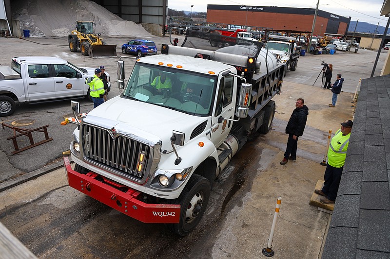 Staff photo by Olivia Ross / Trucks arrive Sunday, ready to be filled with salt brine. Chattanooga public works gave a briefing to members of the media Sunday on the steps Chattanooga is taking concerning the possibility of winter weather.