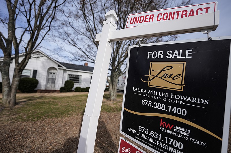 A sign indicating that a home is under contract is shown Jan. 16 in Kennesaw, Ga. The number of homes sold in the Chattanooga area declined nearly 12.5% in 2023 compared with the previous year, and Realtor-assisted home sales last year were nearly 22% below the peak sales year in 2021. (AP Photo/Mike Stewart)