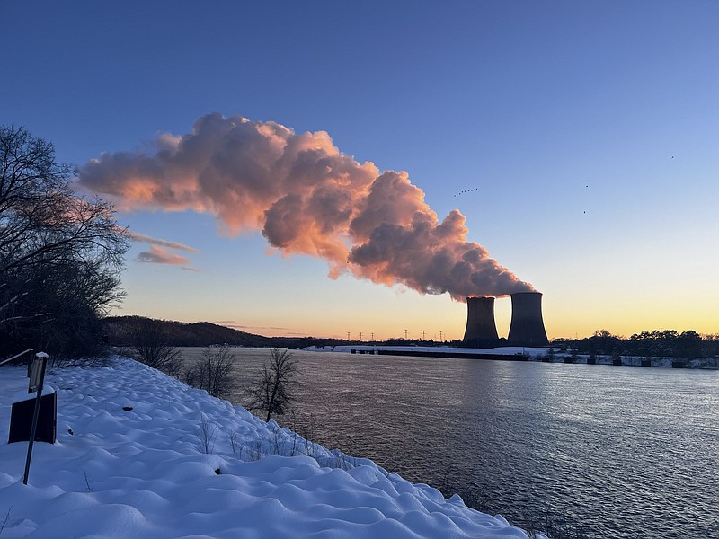 TVA / Steam comes off the cooling towers at the Sequoyah Nuclear Plant on the Tennessee River on Wednesday near Soddy-Daisy. All seven of TVA's nuclear reactors, along with TVA's hydroelectric, gas and coal plants, were operating at full power to help TVA meet an all-time power peak Wednesday morning when temperatures averaged only 4 degrees Fahrenheit across TVA's seven-state region.
