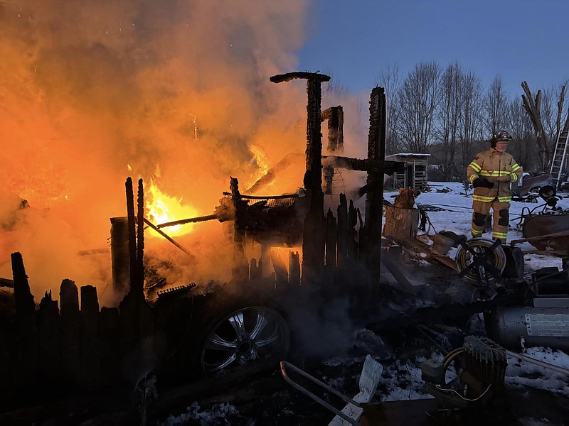 Piney Volunteer Fire Department / Firefighters battle a storage building blaze at Bledsoe County Correctional Complex on Sunday. The building was destroyed but some goats being kept warm inside managed to escape.