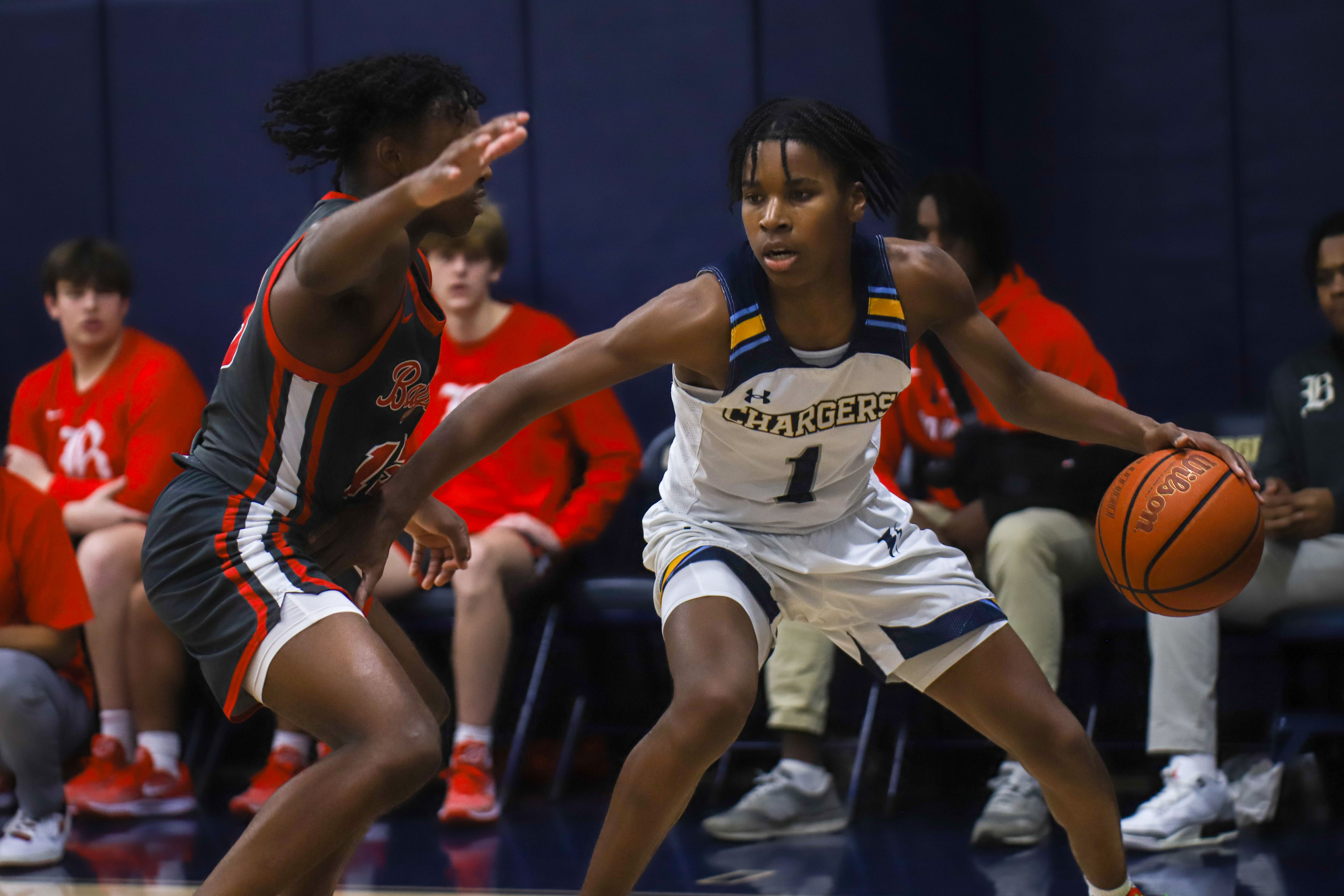 Staff photo by Olivia Ross / CCS's Reid Conley (1) looks to get around Baylor's TJ Fields (13). Chattanooga Christian School took on Baylor at home on Tuesday, January 23, 2024.