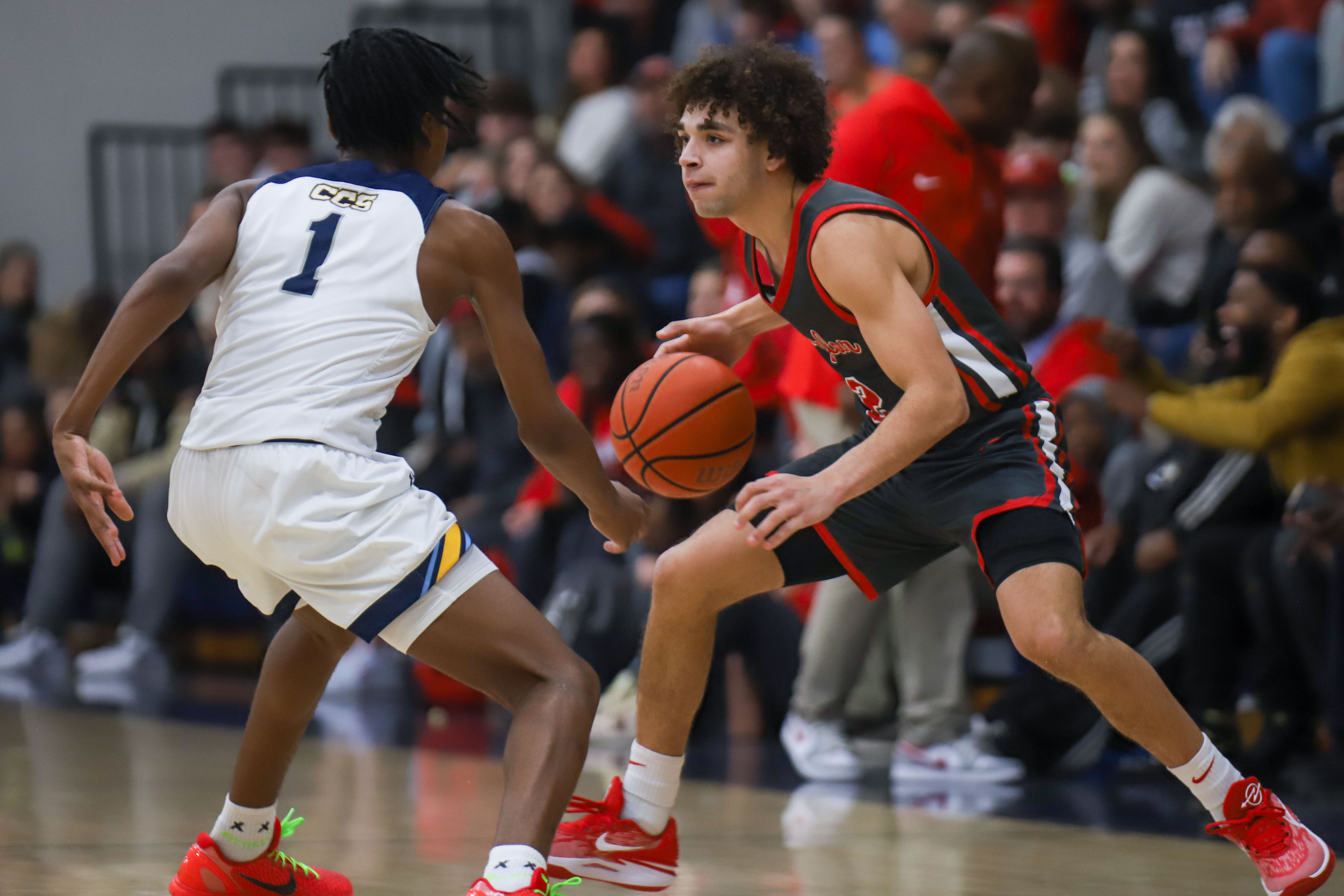 Staff photo by Olivia Ross / Baylor's Nyziah Whaley (2) dribbles the ball around CCS's Reid Conley (1). Chattanooga Christian School took on Baylor at home on Tuesday, January 23, 2024.