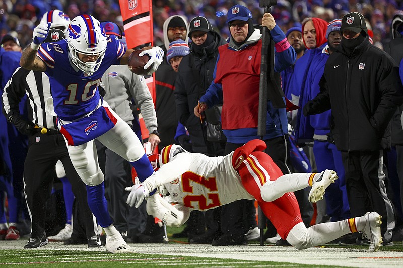 Buffalo Bills wide receiver Khalil Shakir (10) is pulled out of bounds by Kansas City Chiefs safety Chamarri Conner (27) during the fourth quarter of an NFL AFC division playoff football game, Sunday, Jan. 21, 2024, in Orchard Park, N.Y. (AP Photo/Jeffrey T. Barnes)