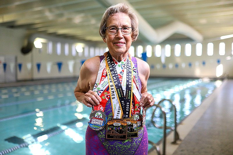 Staff photo by Olivia Ross / Marilyn Beckner poses with her medals at the Downtown YMCA.