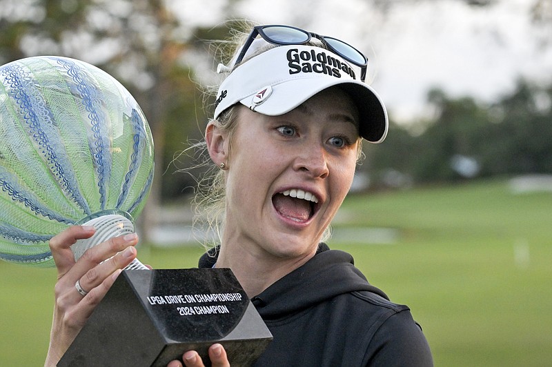 AP photo by Steve Nesius / Nelly Korda holds her trophy after winning the LPGA Drive On Championship Sunday at Florida's Bradenton Country Club. Korda's wire-to-wire win was secured on the second hole of a playoff against Lydia Ko.