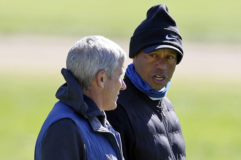 AP photo by Ryan Kang / Longtime PGA Tour star Tiger Woods, right, talks to Jay Monahan, the tour's commissioner, at Riviera Country Club in Los Angeles in February 2023. On Wednesday, the tour announced a $3 billion investment from Strategic Sports Group that would give players access to more than $1.5 billion as equity owners in the new PGA Tour Enterprises.