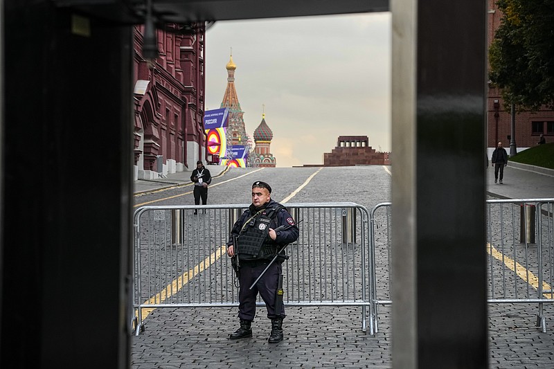 AP Photo/Alexander Zemlianichenko / A policeman stands in front of barriers that block access to Red Square with St. Basil's Cathedral and the Lenin Mausoleum in the background on Thursday, Sept. 29, 2022.