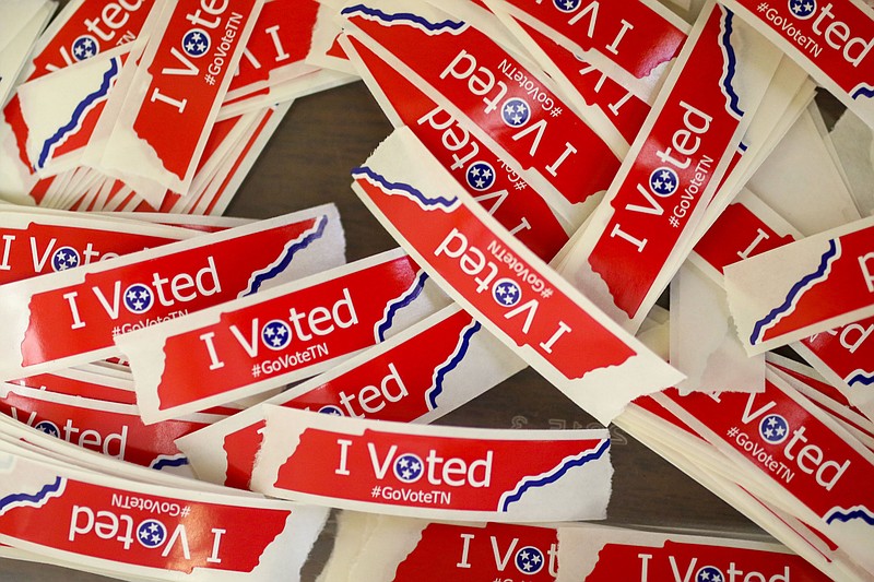 Staff photo by Olivia Ross / "I Voted" stickers sit in a bucket at the Hamilton County Election Commission in 2022.