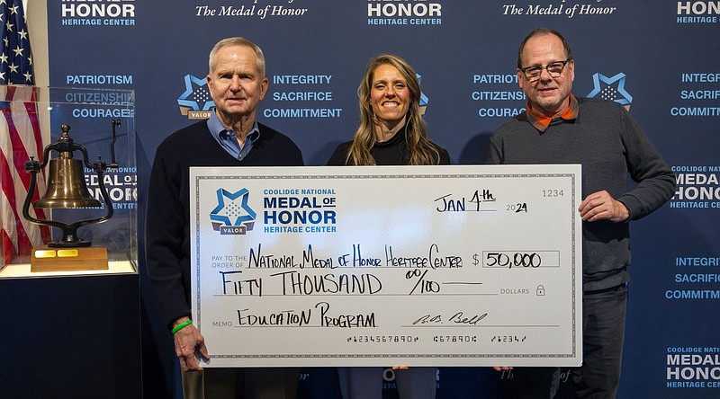 Contributed photo / At the check presentation, from left, are retired Army Gen. B.B. Bell; and Maranda Wilkinson and David Currey of the Coolidge National Medal of Honor Heritage Center.