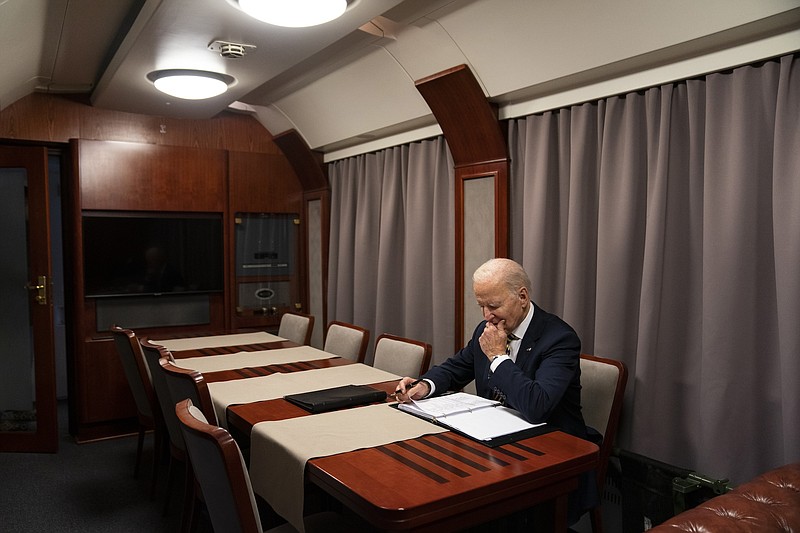 File photo/Evan Vucci, Pool/The Associated Press / President Joe Biden sits on a train as he goes over his speech marking the one-year anniversary of the war in Ukraine after a surprise visit with Ukrainian President Volodymyr Zelenskyy on Monday, Feb. 20, 2023, in Kyiv. More Americans think foreign policy should be a top focus for the U.S. government in 2024 amid ongoing wars in the Gaza Strip and Ukraine.