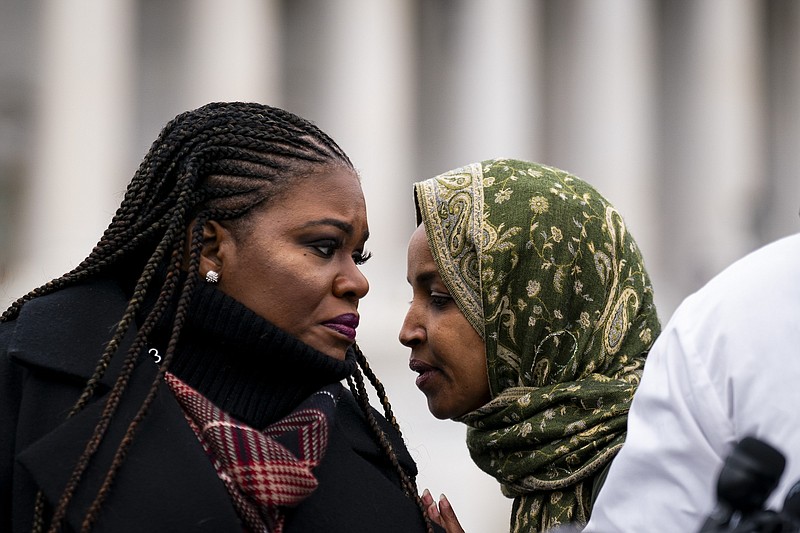 File photo/Al Drago/The New York Times / U.S. Rep. Cori Bush, D-Missouri, confers with Rep. Ilhan Omar, D-Minnesota, right, during a news conference calling for a permanent ceasefire of the Israel-Hamas war, outside the Capitol in Washington on Thursday, Dec. 7, 2023.
