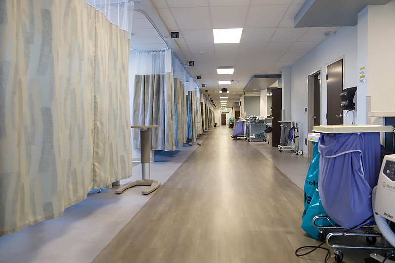 Staff photo by Olivia Ross / A hallway lined with pre-op and recovery bays is pictured at the of Center for Sports Medicine & Orthopaedics on Monday, January 29, 2024.