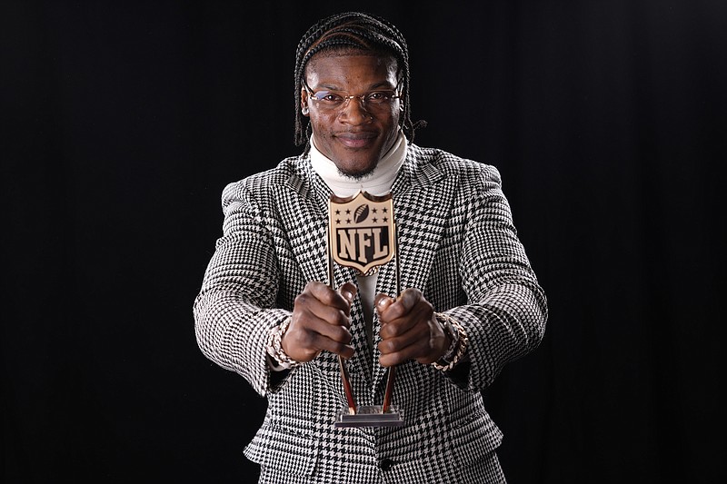 AP photo by Matt York / Baltimore Ravens quarterback Lamar Jackson poses after winning the NFL MVP award at NFL Honors on Thursday night in Las Vegas, the site of Super Bowl LVIII between the Kansas City Chiefs and the San Francisco 49ers on Sunday.