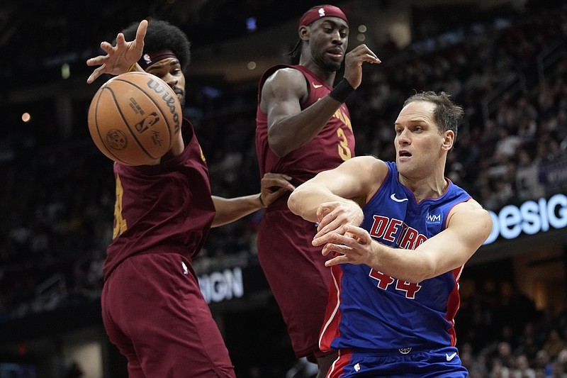 AP photo by Sue Ogrocki / Detroit Pistons forward Bojan Bogdanovic, right, passes around Cleveland Cavaliers center Jarrett Allen on Jan. 31. Bogdanovic is now with the New York Knicks, changing teams in one of several deals finalized Thursday at the NBA's trade deadline.