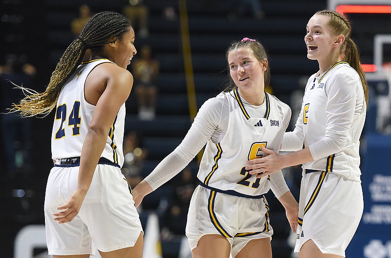 Staff file photo by Matt Hamilton / The UTC women's basketball team won 61-52 on Saturday at Mercer with contributions from multiple players, including 21 points from Jada Guinn, left, eight rebounds from Addie Porter, center, and standout defense from Sigrun Olafsdottir, right.