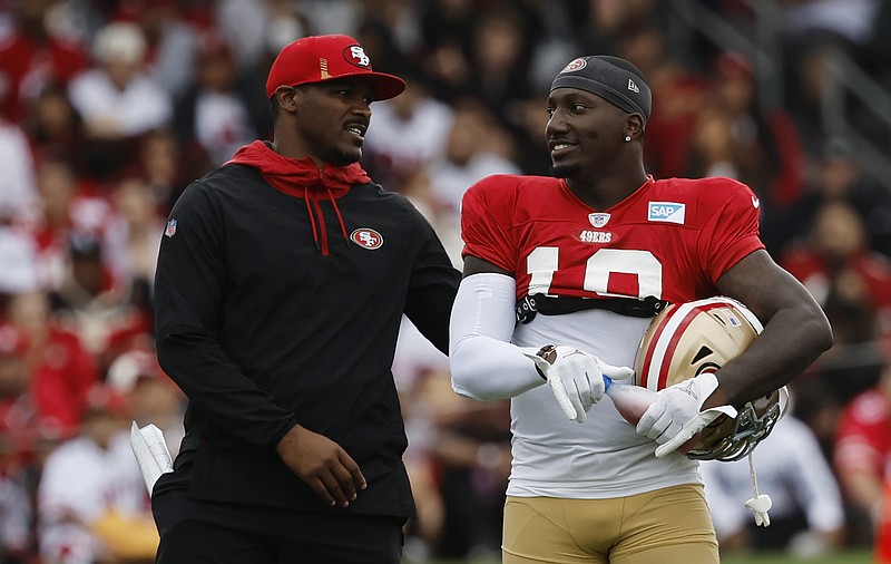 AP file photo by Josie Lepe / San Francisco 49ers receiver Deebo Samuel, right, chats with defensive backs coach Daniel Bullocks during practice in Santa Clara, Calif. Bullocks, a Chattanooga prep star at Hixson before playing at Nebraska and in the NFL, is in his seventh season as an assistant for the 49ers, who face the Kansas City Chiefs at Super Bowl LVIII on Sunday in Las Vegas.