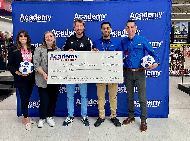Contributed photo / At the check presentation at Academy Sports, from left are Madyson Smith, Mikaela Sites and Juan Hernandez, all with Chattanooga FC; and Malcolm Falardeau and Cory Subketkaew, who are with Academy Sports + Outdoors.